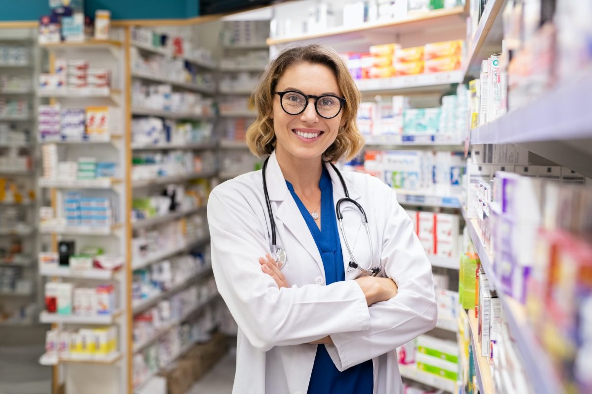 Happy smiling pharmacist in drugstore